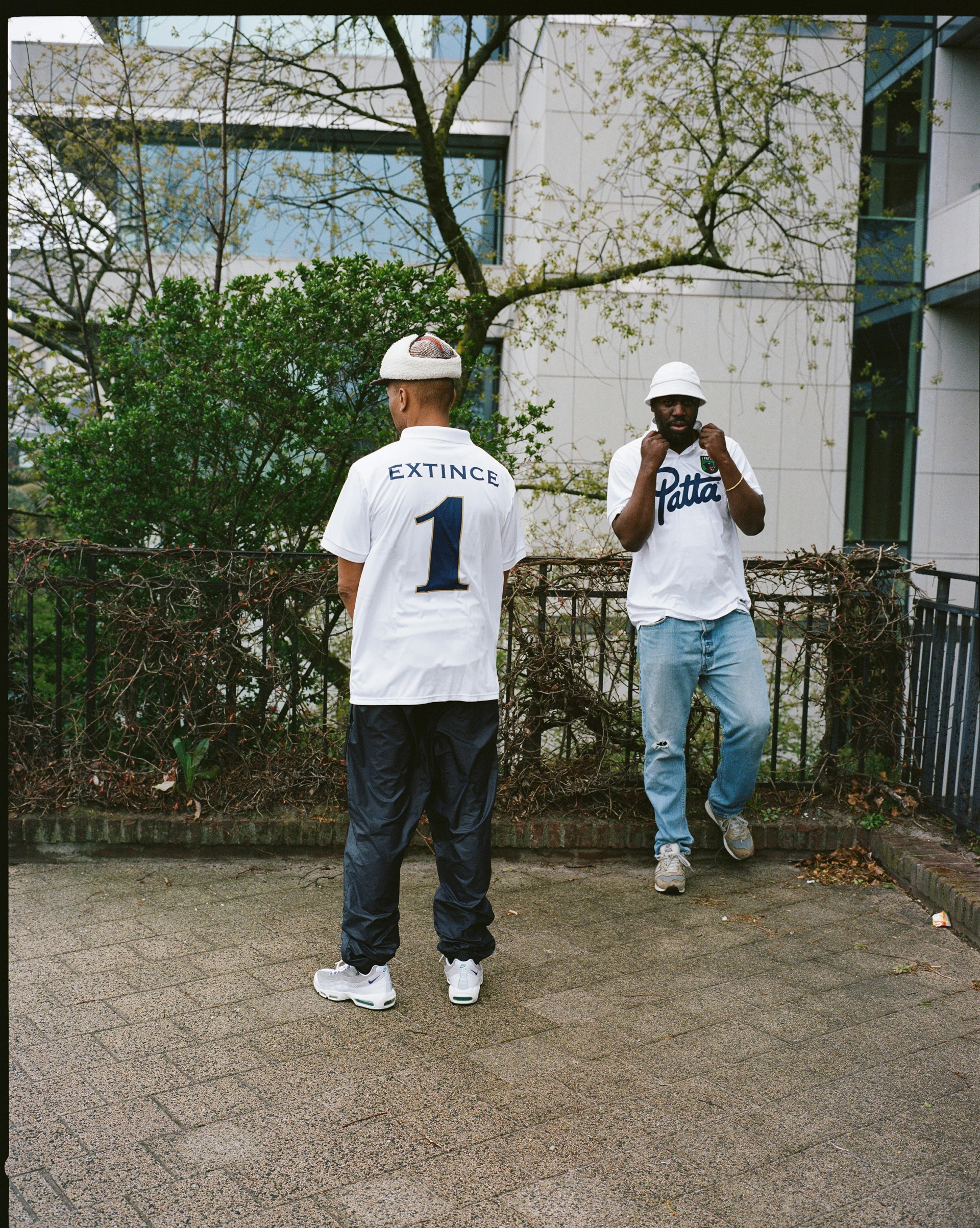 Two men wearing Extince Patta shirts